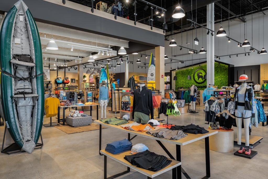 Interior of sales floor in Backcountry retail with paddle boards and canoeing.