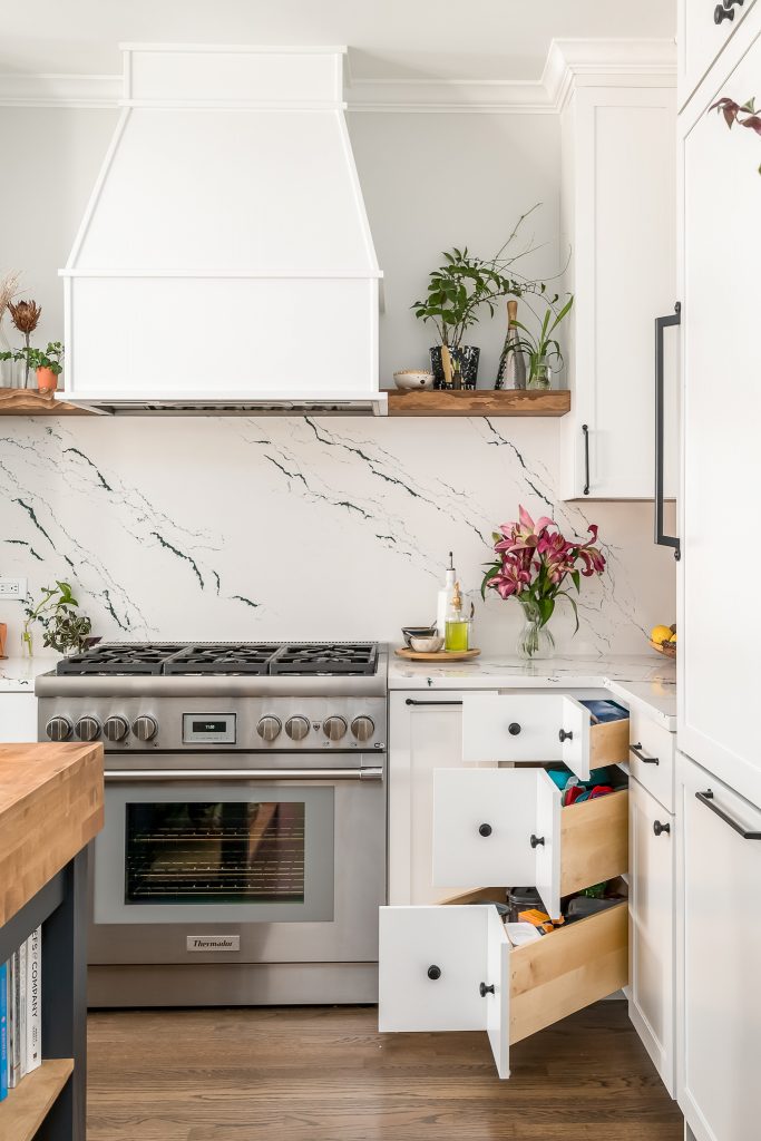 Detail of corner cabinet design in modern white kitchen renovation