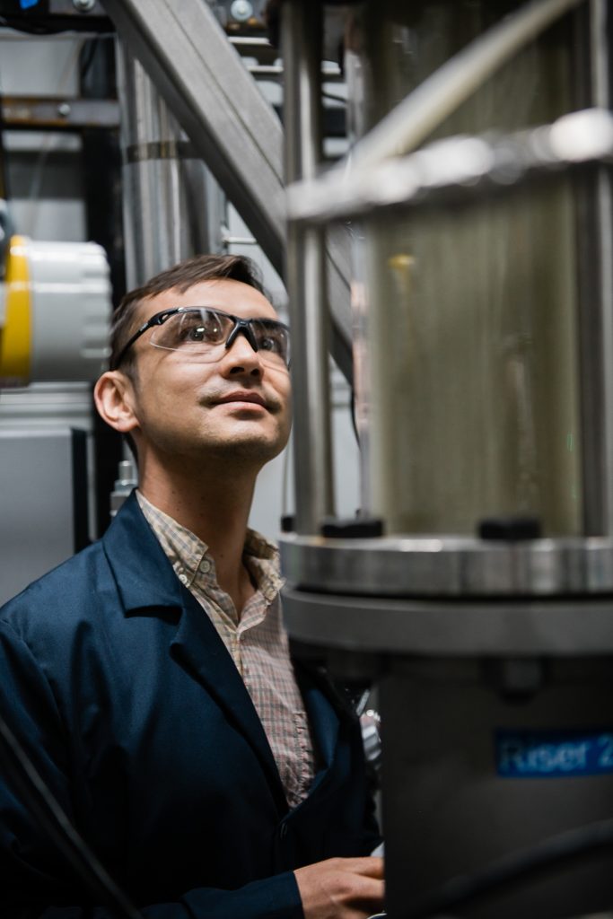 Laboratory Technician calibrating machinery