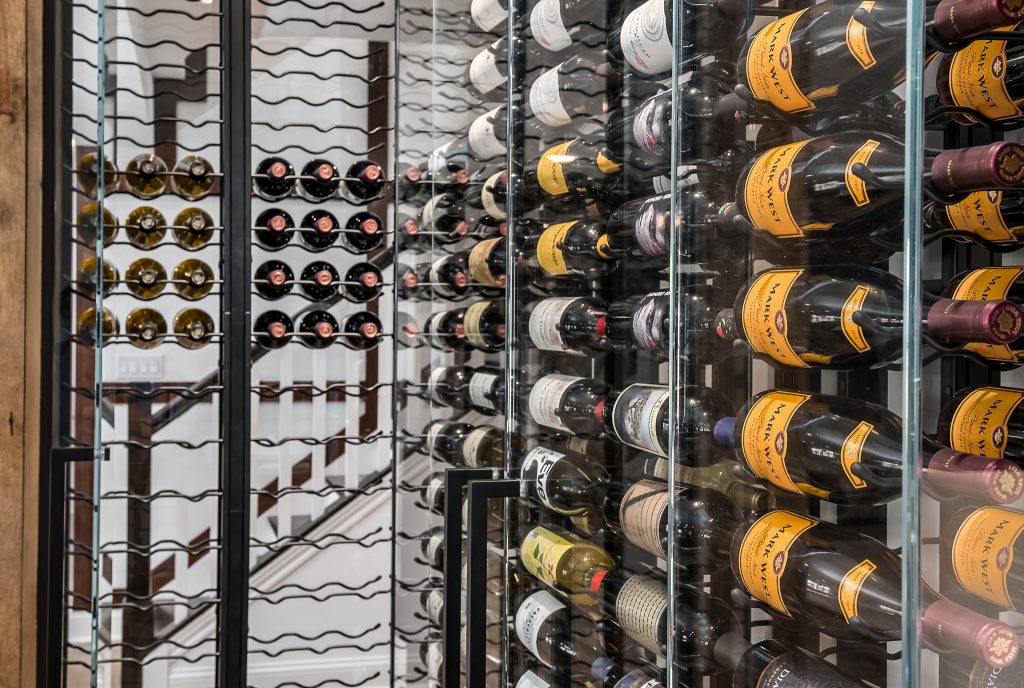 Close Up Details of Wine Bottles in Modern Wine Cellar