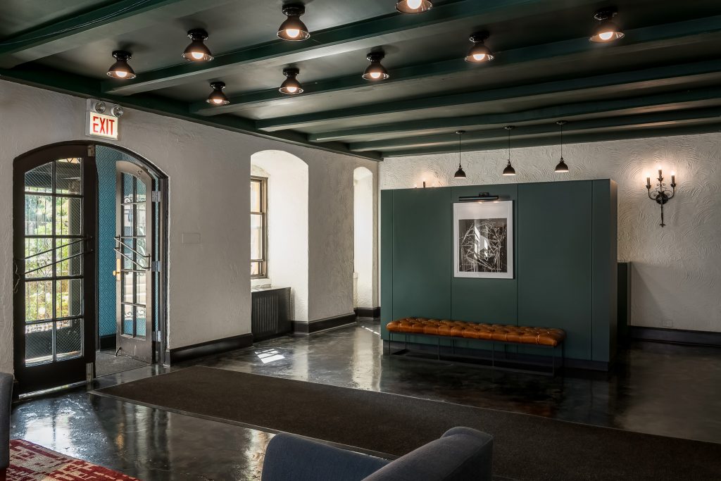 Apartment Building Lobby with Dramatic Lighting and Dark Ceiling