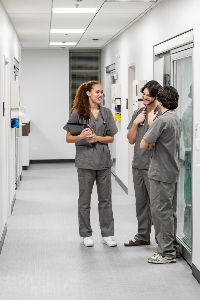Concordia University Chicago BSN Program, Nursing Simulation Lab with students talking in hallway, Educational and Healthcare Photos