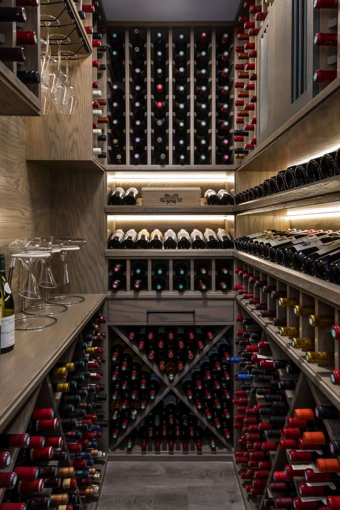 Interior Custom Wine Cellar Full of Wine Bottles and Glass Decanters
