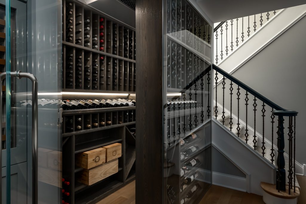 Traditional interior design custom wine cellar in finished basement.