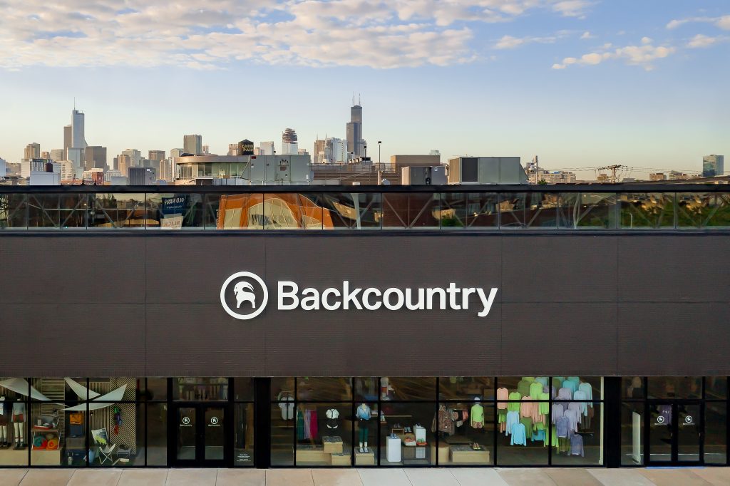 Aerial photo of Backcountry retail location in Chicago with city skyline in the background.
