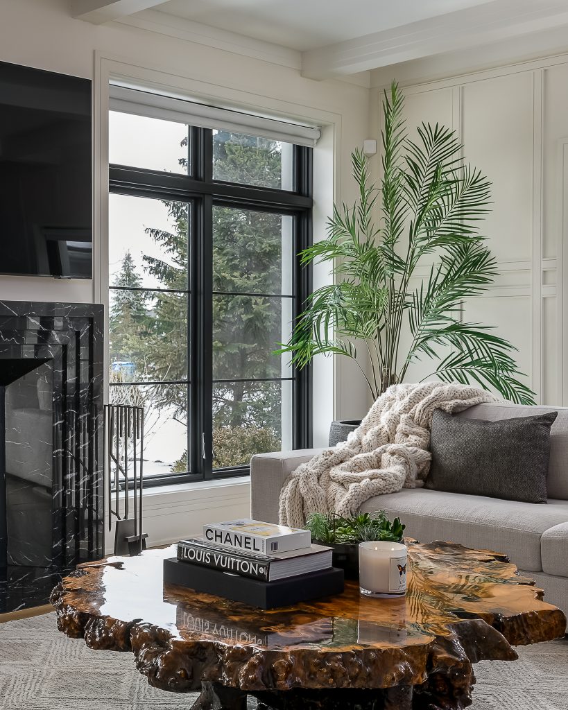 Modern interior design living room with neutral furniture and large windows