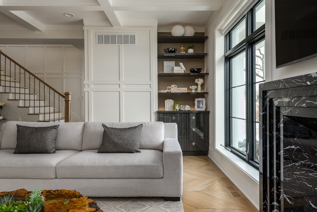 Styled bookshelf in modern transitional living room.
