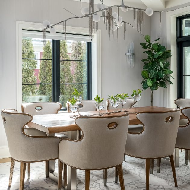 Modern dining room with dramatic chandelier and centerpiece