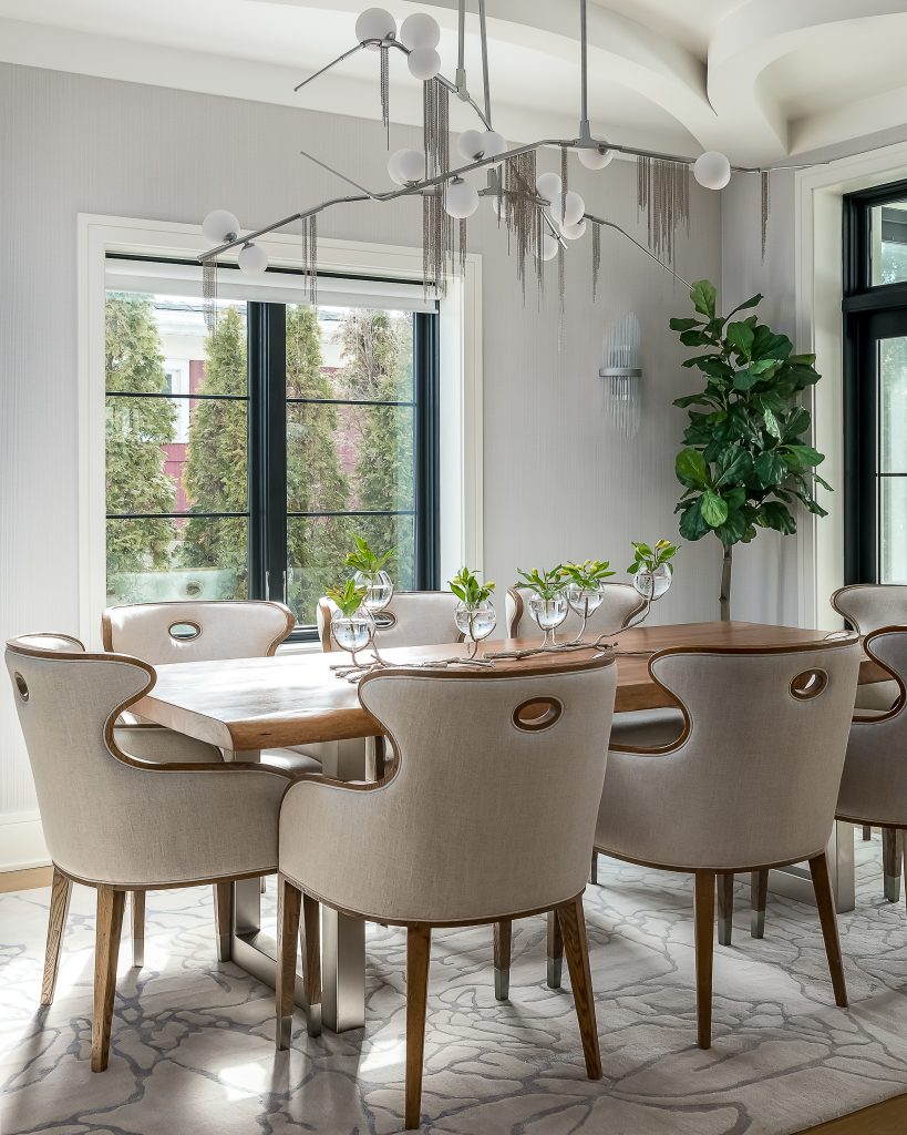 Modern dining room with dramatic chandelier and centerpiece