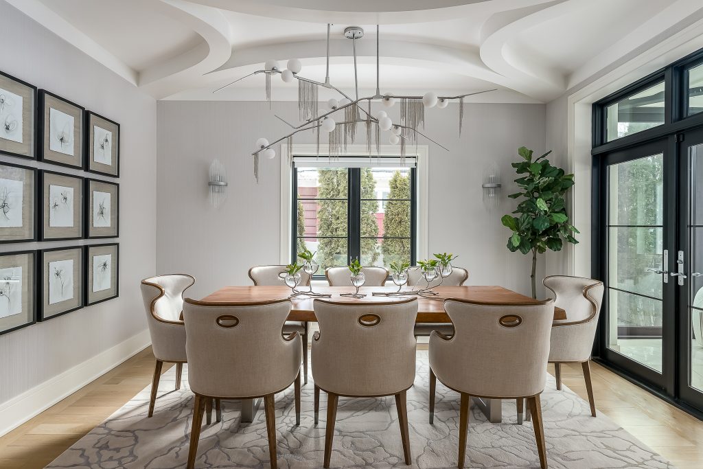 Modern dining room with dramatic chandelier.