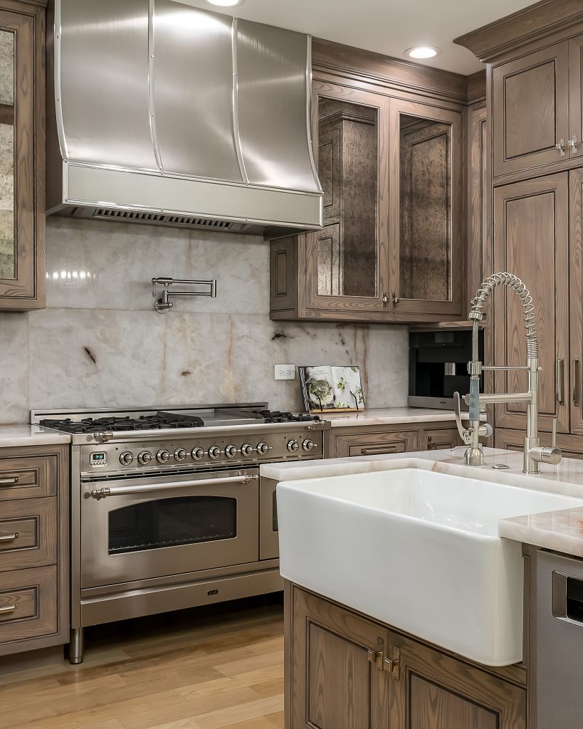 Custom kitchen with high end finishes, farmhouse sink, and luxury appliances.