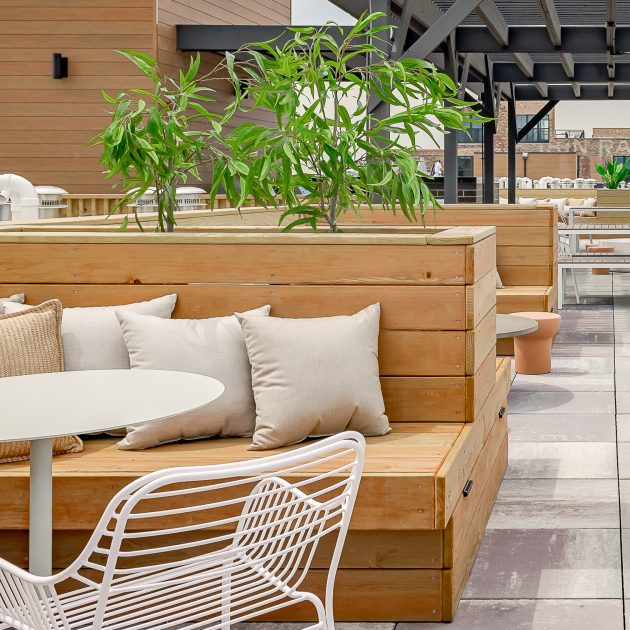 Rooftop Common area detail of seating with throw pillows