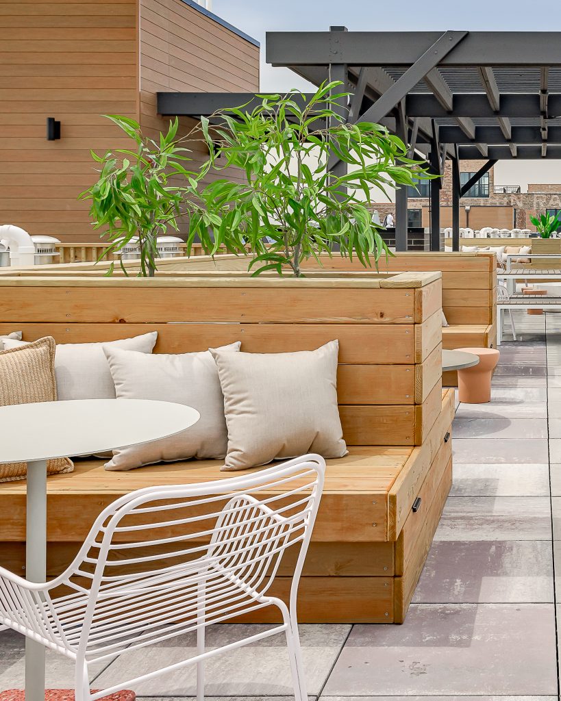 Rooftop Common area detail of seating with throw pillows