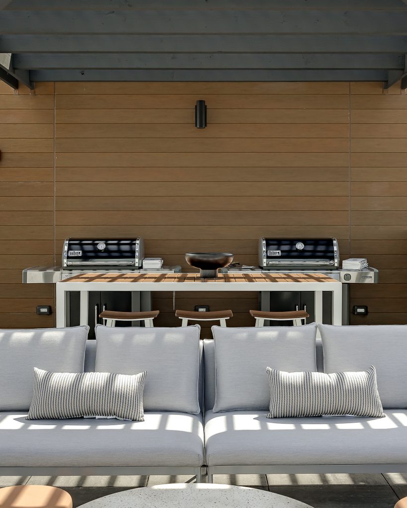 Rooftop deck with luxury seating and outdoor grills