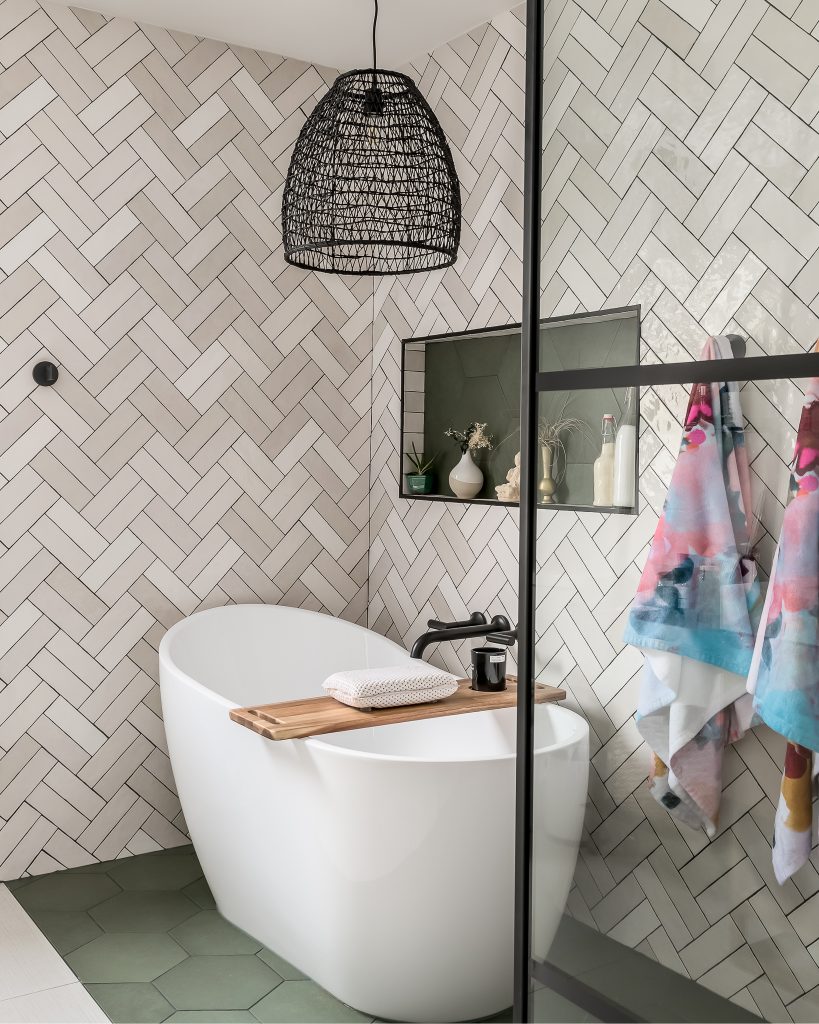 Modern bathroom renovation featuring stand alone tub and walk in shower