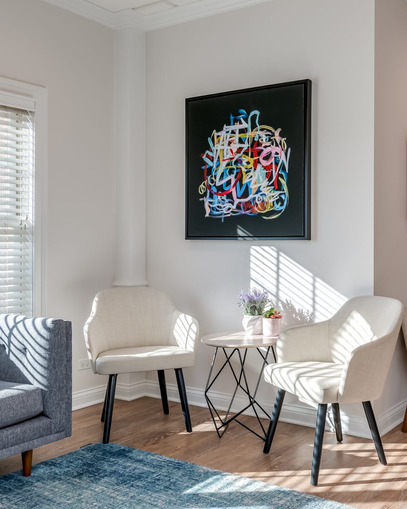 Vignette of waiting chairs with dramatic lighting in dental office lobby