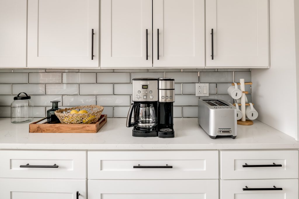 White kitchen counters with toaster and coffee maker