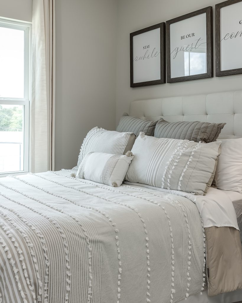 Detail of cozy bedding in a Ryan Homes model home