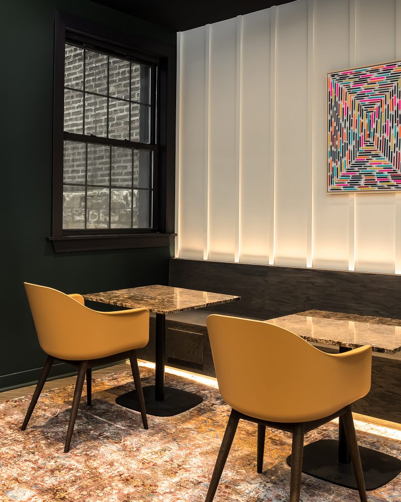 Modern Apartment lobby with dramatic details and cafe seating