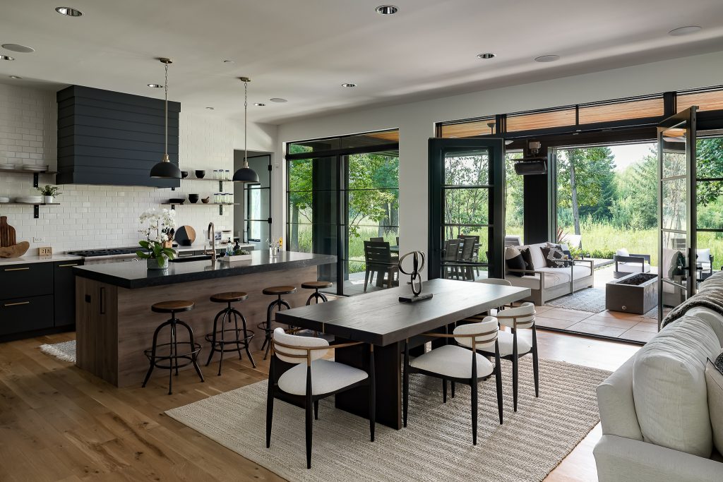Open concept dining room and kitchen with views to indoor-outdoor entertaining space