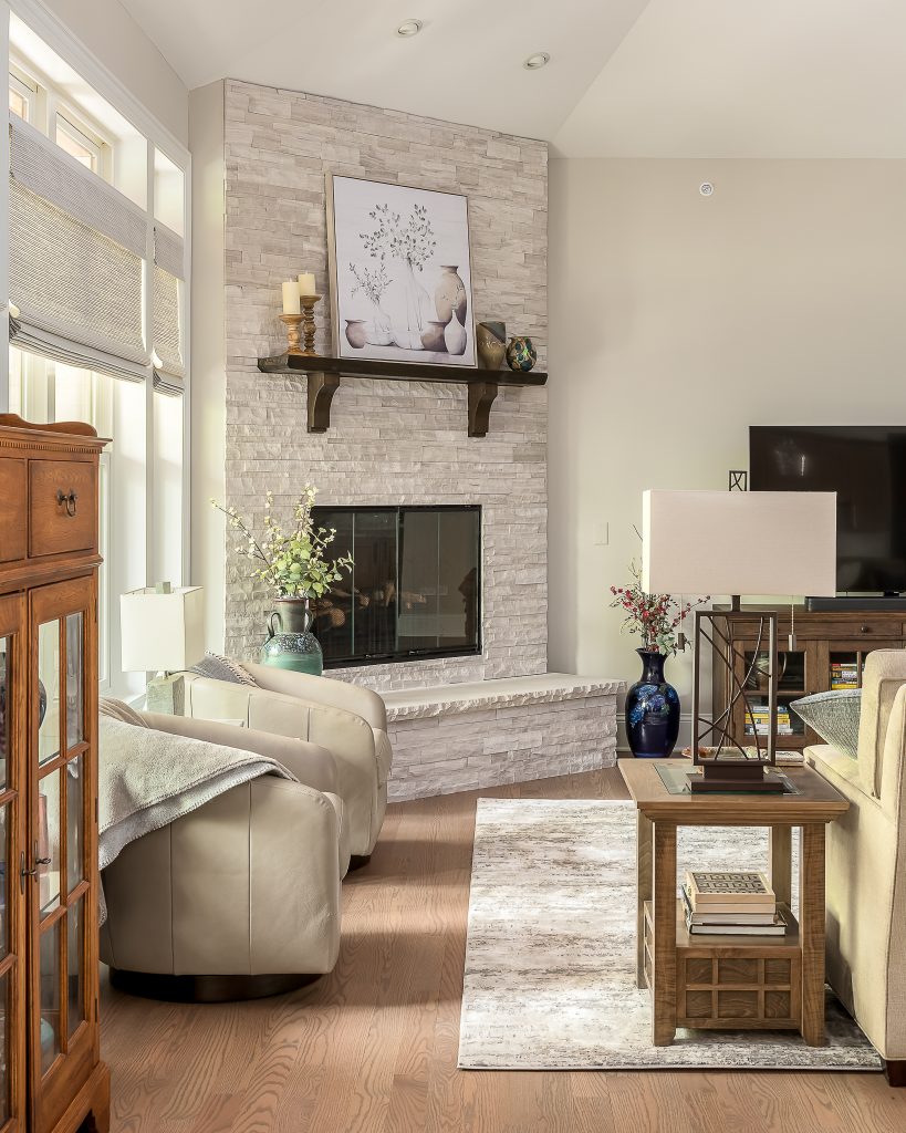 Fireplace detail in cozy, rustic inspired living room.