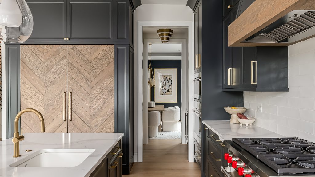 A view through a modern kitchen into a contemporary dining room