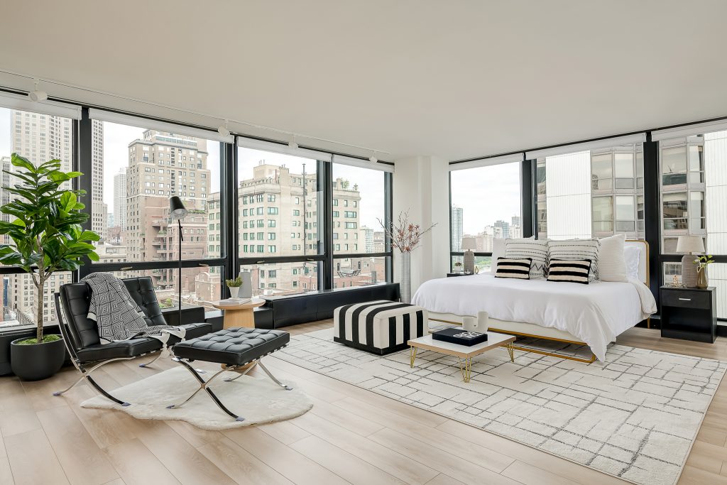 Panoramic downtown Chicago views in condo bedroom.