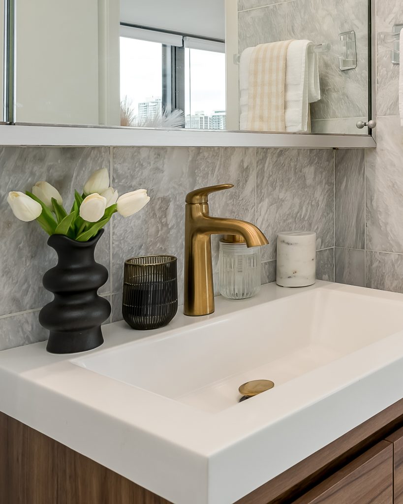 Close up of gold bathroom faucet