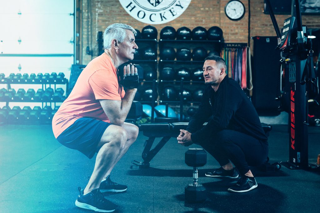 Client with trainer learning functional fitness