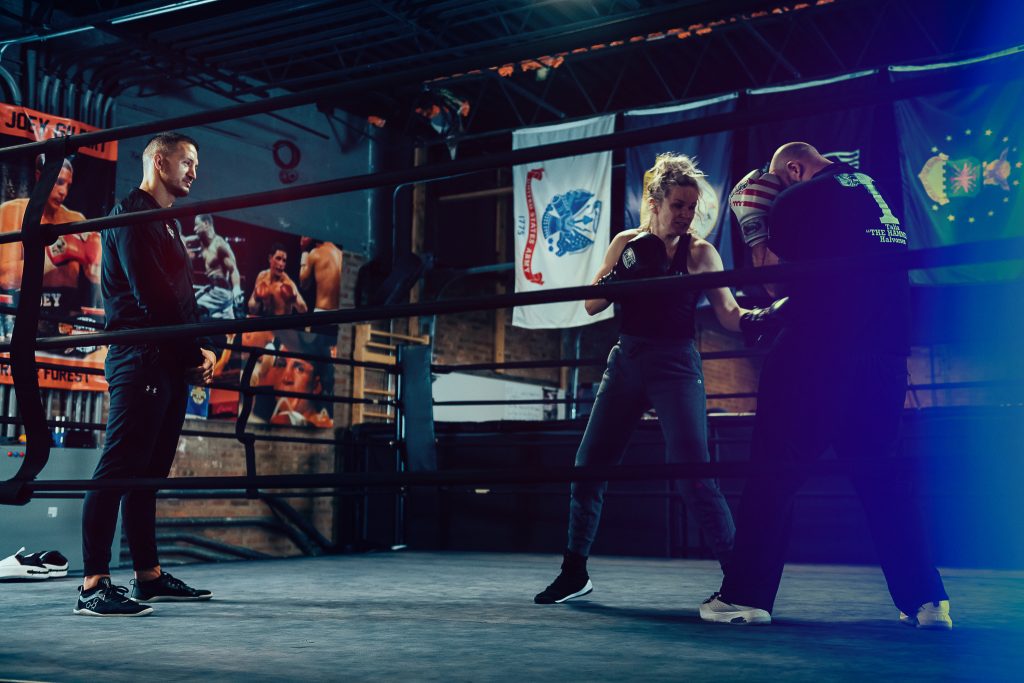 Private instruction in boxing ring